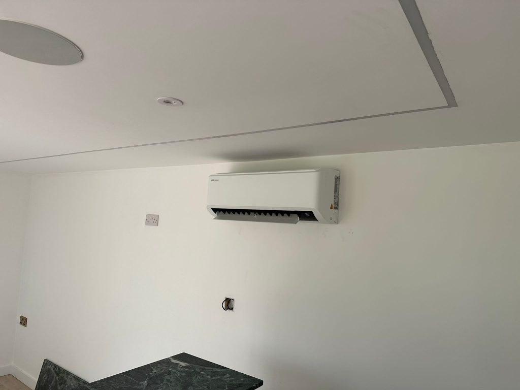 an AC unit attached to a white wall